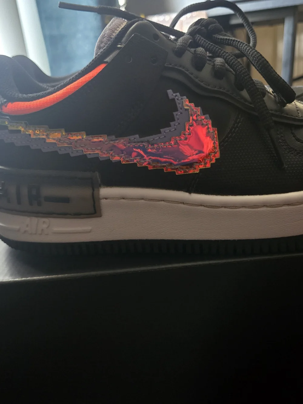 Nike Women’s Black Sneakers with Neon Orange Pixel Swoosh